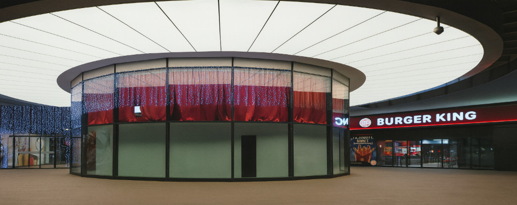 Circular stretch ceiling with hidden lighting – modern illuminated ceiling for luxurious commercial entrances