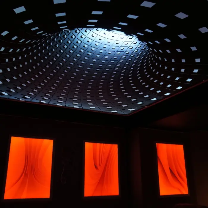 3D stretch ceiling installation with modern glossy finish and hidden lighting